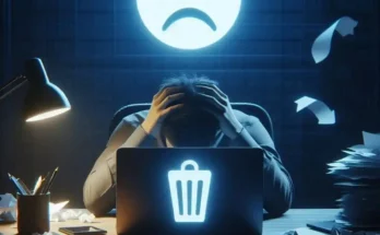 Person stressed after accidentally deleting important files from computer